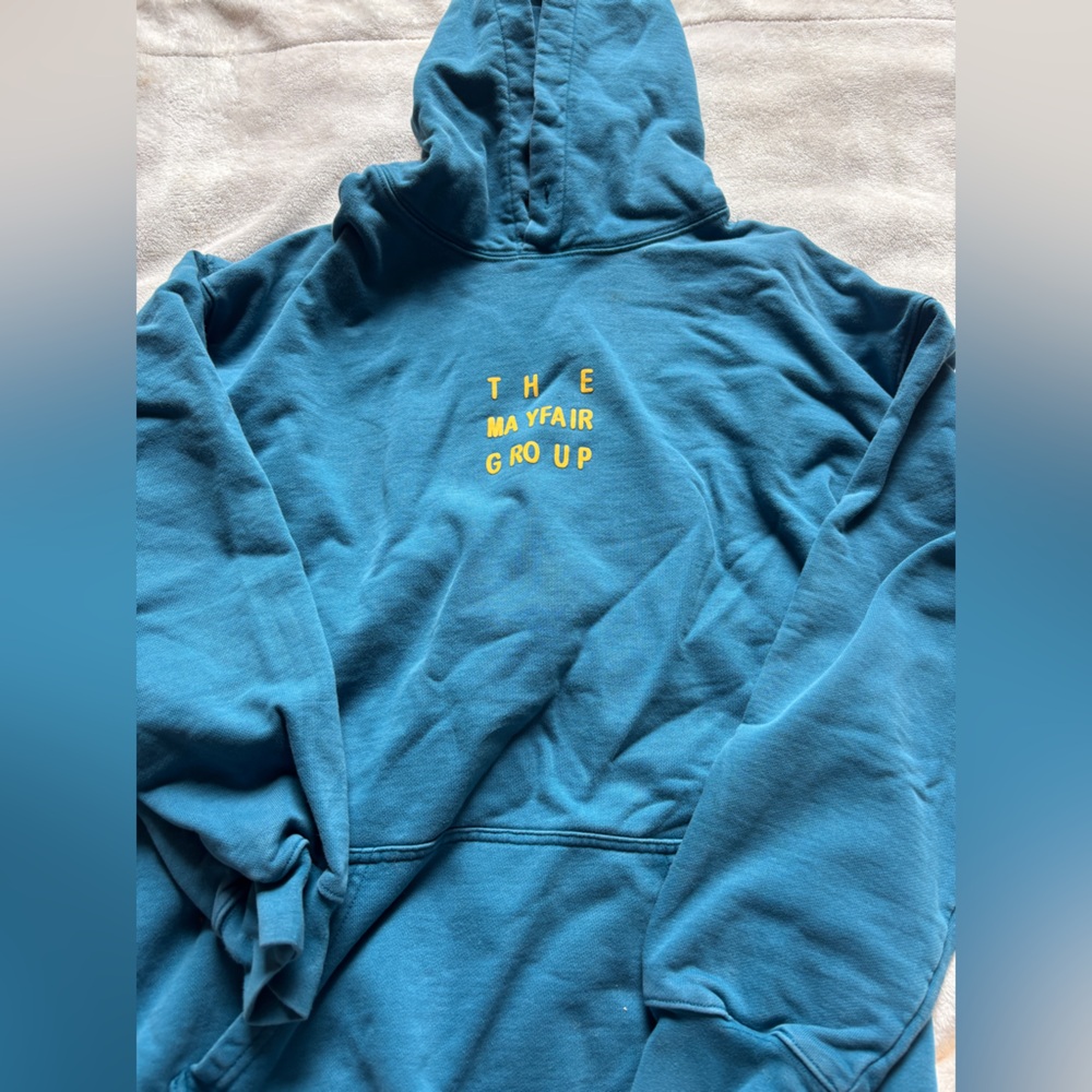 the mayfair group Blue Hoodie with Yellow Text